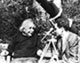 Einstein talking with Zvi Gezari in the backyard of Princeton home, and a telescope in the background.