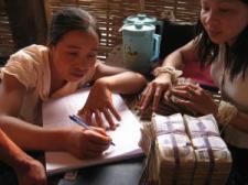 Women managing village fund - (c) European Communities