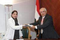 Dr. Amira receiving her contract