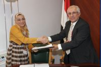 Dr. Ghada receiving her contract