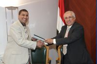 Dr. Mahmoud receiving his contract