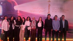  Les lauréats avec l'affiche du festival.